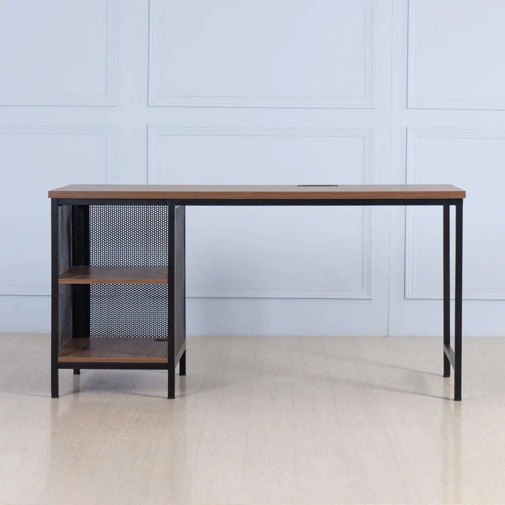 Wooden desk with metal mesh shelf against a light blue paneled wall.