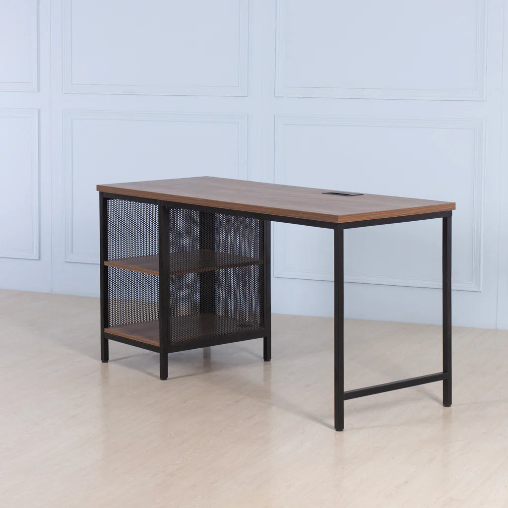 Wooden desk with black metal frame against a light blue paneled wall.